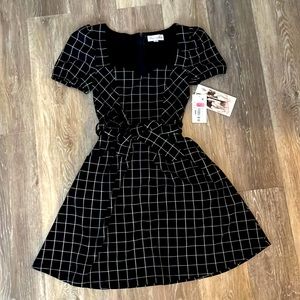 This is a black and white stipe dress from macys. Never worn brand new with tags